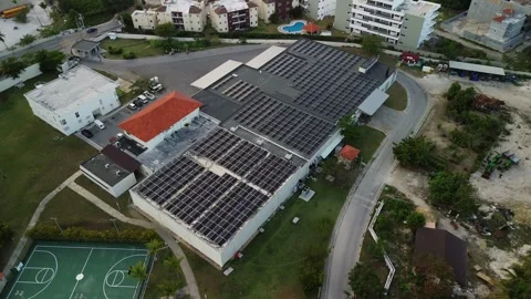 Aerial view of technical building with solar panels on flat roof residential Stock Footage 274485827