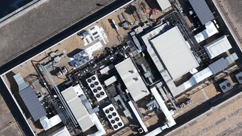 Aerial view of technicians maintaining hvac system on rooftop 스톡 동영상 342924475