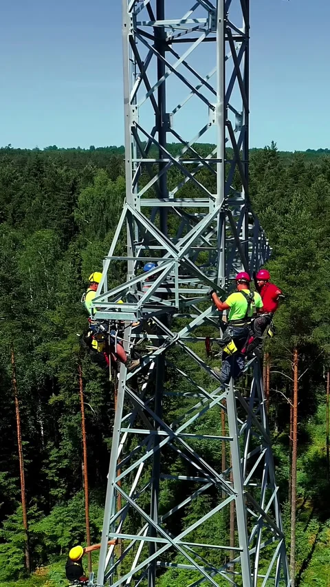 Aerial view of technicians on a telecommunications tower, Latvia. Stock Footage 340635831