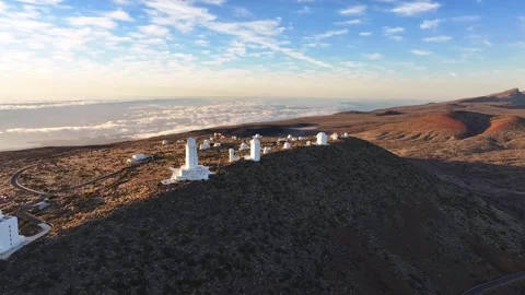Aerial View of Teide Observatory Above Clouds on Volcanic Landscape in Tenerife Stock Footage 345590498