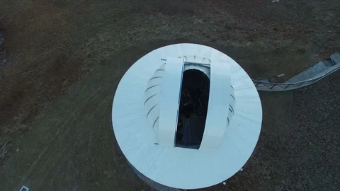 Aerial view of a telescope inside the dome of an astronomical observatory. Stock Footage 81190270