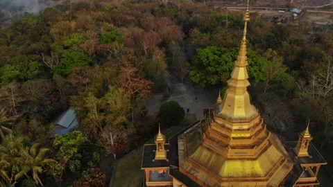 Aerial view of temple at sunset surrounded by forest, Laos. Stock Footage 345228638