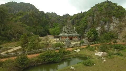 Aerial view of temple surrounded by scaffolding as restoration work, Cambodia Stock Footage 83535055