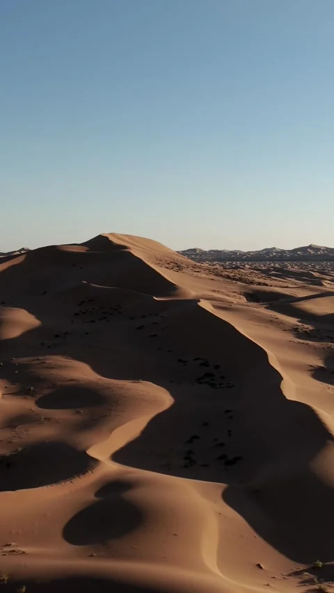 Aerial View of Tengger Desert Dunes at Golden Hour Stock Footage 345367357