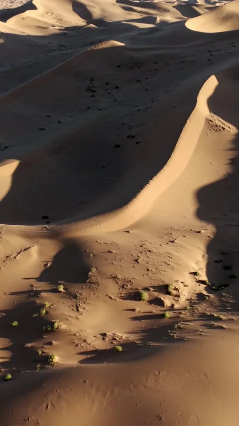 Aerial View of Tengger Desert Dunes at Golden Hour Stock Footage 345367463