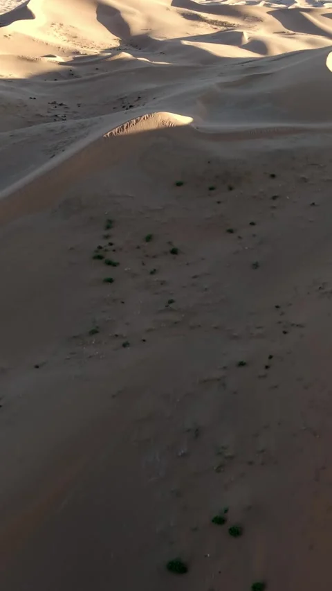 Aerial View of Tengger Desert Dunes at Golden Hour Stock Footage 345367708