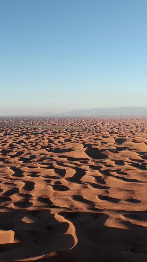Aerial View of Tengger Desert Dunes at Golden Hour Stock Footage 345368249