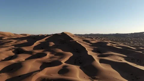 Aerial View of Tengger Desert Dunes at Golden Hour Stock Footage 345369546