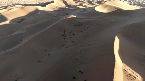 Aerial View of Tengger Desert Dunes at Golden Hour Stock Footage 345369660