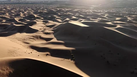 Aerial View of Tengger Desert Dunes at Golden Hour Stock Footage 345369679