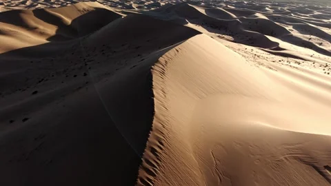 Aerial View of Tengger Desert Dunes at Golden Hour Stock Footage 345369720