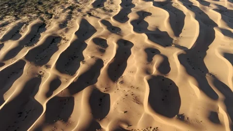 Aerial View of Tengger Desert Dunes and Road Stock Footage 345369891
