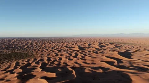 Aerial View of Tengger Desert Dunes at Golden Hour Stock Footage 345369908