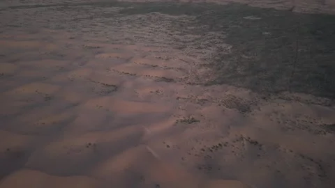 Aerial view of Tengger Desert dunes at golden hour Stock Footage 345370213