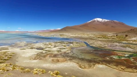 Aerial view of Termas de Polques, mountain peak with snow, Atacama desert, Chile Stock Footage 72183650