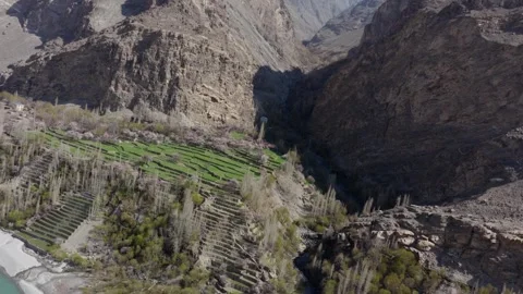 Aerial view of terraced fields in a mountainous valley in Pakistan, highlighting 스톡 동영상 317958199