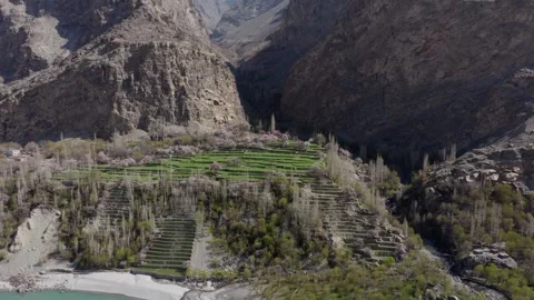 Aerial view of terraced fields in a mountainous region of Pakistan, highlighting Video stock 317958339