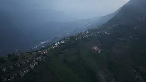 Aerial view of terraced rice fields and mountain resort in Sa Pa, Lao Cai, Vietn Stock Footage 340025023