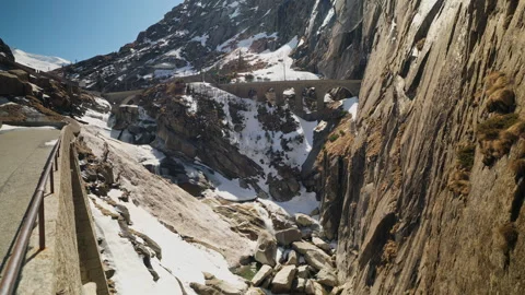 Aerial view of Teufelsbrücke Devil's Bridge over Schöllenen gorge with snow and Stock Footage 333988495