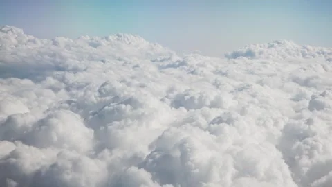 Aerial View of Textured White Clouds Spreading Across the Sky from Airplane Vídeos de archivo 346105848