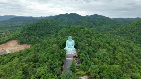Aerial View of Thai Temple and Giant Buddha in Mountain Forest Stock Footage 343027288