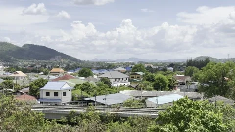 Aerial View Thai Town Rooftops Mountains Clouds  Hua Hin Thailand 4K HDR Stock Footage 335698094