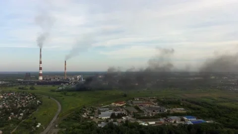 Aerial view to thermal power station in industrial area of Russian town Stock Footage