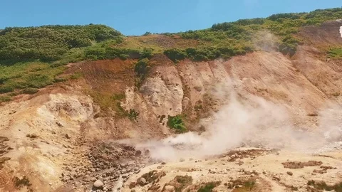 Aerial View. Thermal spring gushes out of the ground. Hot spring water in the Stock Footage 73141115