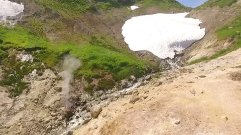 Aerial View. Thermal spring gushes out of the ground. Hot spring water in the Stock Footage 73141656