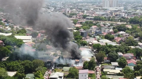 Aerial View of Thick Black Smoke Billowing from Fire in Residential Neighborhood Stock Footage 346470651