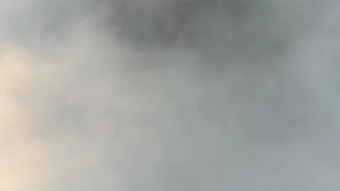 Aerial view of thick clouds over the old city, cinematic view from an aircraft Stock Footage 157850633