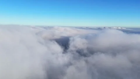 Aerial view of thick white clouds under a blue sky, Austria. Stock Footage 335667135