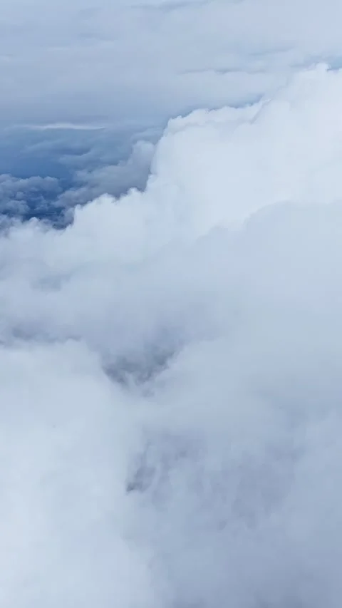 Aerial View of Thick White Clouds and Sky Layers from Above in Daylight Stock Footage 337385942