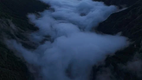 Aerial View Of Thick White Clouds Filling Valseriana Mountain Valley At Dusk Stock Footage 341657762