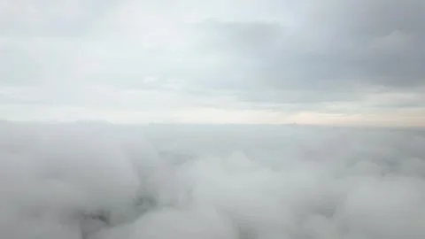 Aerial view of thick white clouds covering the city of Guangzhou at dawn Vídeos de archivo 347067056