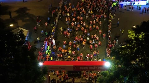 Aerial view of thousand of runners started the marathon in front of Saigon Zo Stock Footage 157118361
