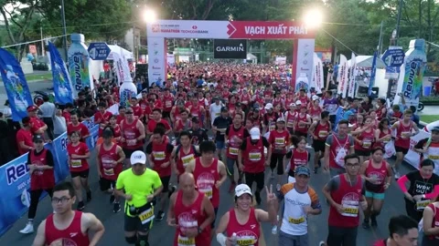 Aerial view of thousand of runners started the marathon in front of Saigon Zo Stock Footage 157118565