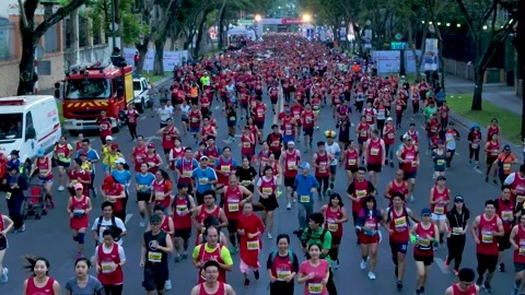 Aerial view of thousand of runners started the marathon in front of Saigon Zo Stock Footage 157118607