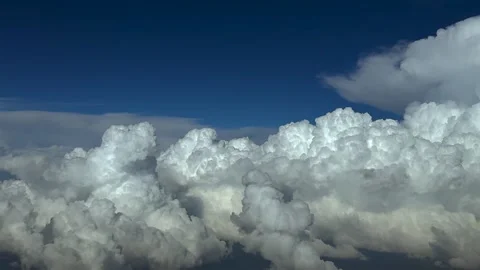 Aerial View of Threatening Storm Clouds Under a Deep Blue Sky at Sunset Stock Footage 319071511