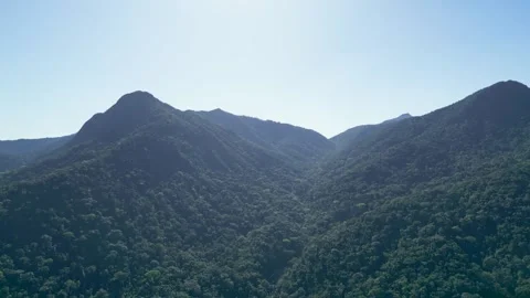 Aerial View of Three Atlantic Forest Mountain Peaks Under Blue Sky – Ilhabela Vidéo 334617679
