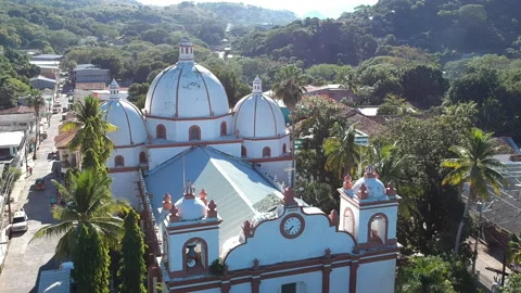 Aerial view of a three domes old church in Pespire Stock Footage 146708409