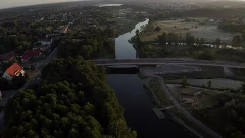 Aerial View of a Three Lane Bridge Over the Long Calm River Stock Footage 138518079