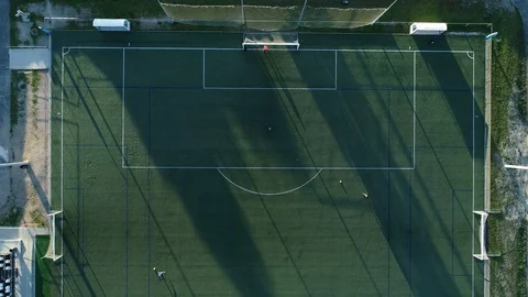 Aerial view of three men training soccer Stock-Footage 126242732