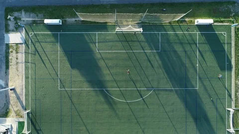 Aerial view of three men training football Vídeo Stock 126242861