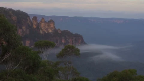 Aerial View of the Three Sisters in the Blue Mountains, Fog Covering Valley Stock Footage 316580255