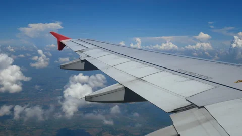 Aerial view through an airplane window with light from len flare . Stock Footage 133552530