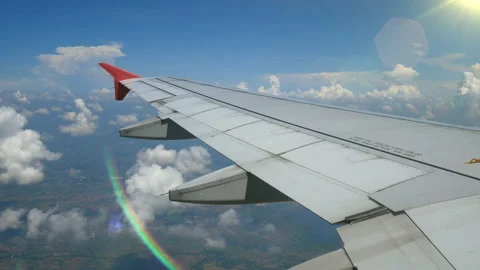 Aerial view through an airplane window with light from lens flare. 動画素材 134519736
