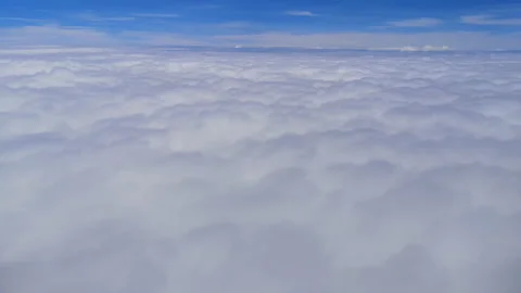 An aerial view of through clouds from the plane in Thailand. Stock Footage 141142807