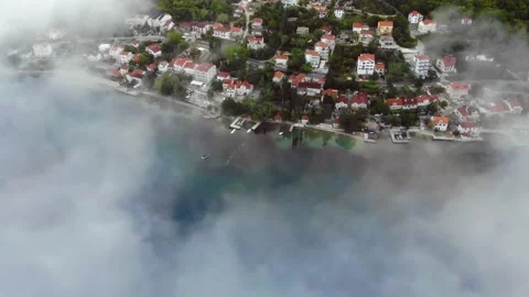 Aerial View Through The Fog To Small Town On The Waterfront Stock Footage 131436452