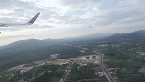 Aerial view through plane window with view of plane wing while climbing Tak.. Video stock 329676722